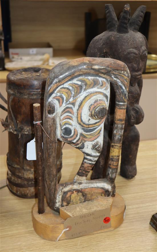 Two tribal carvings and a hardwood drum tallest 52cm